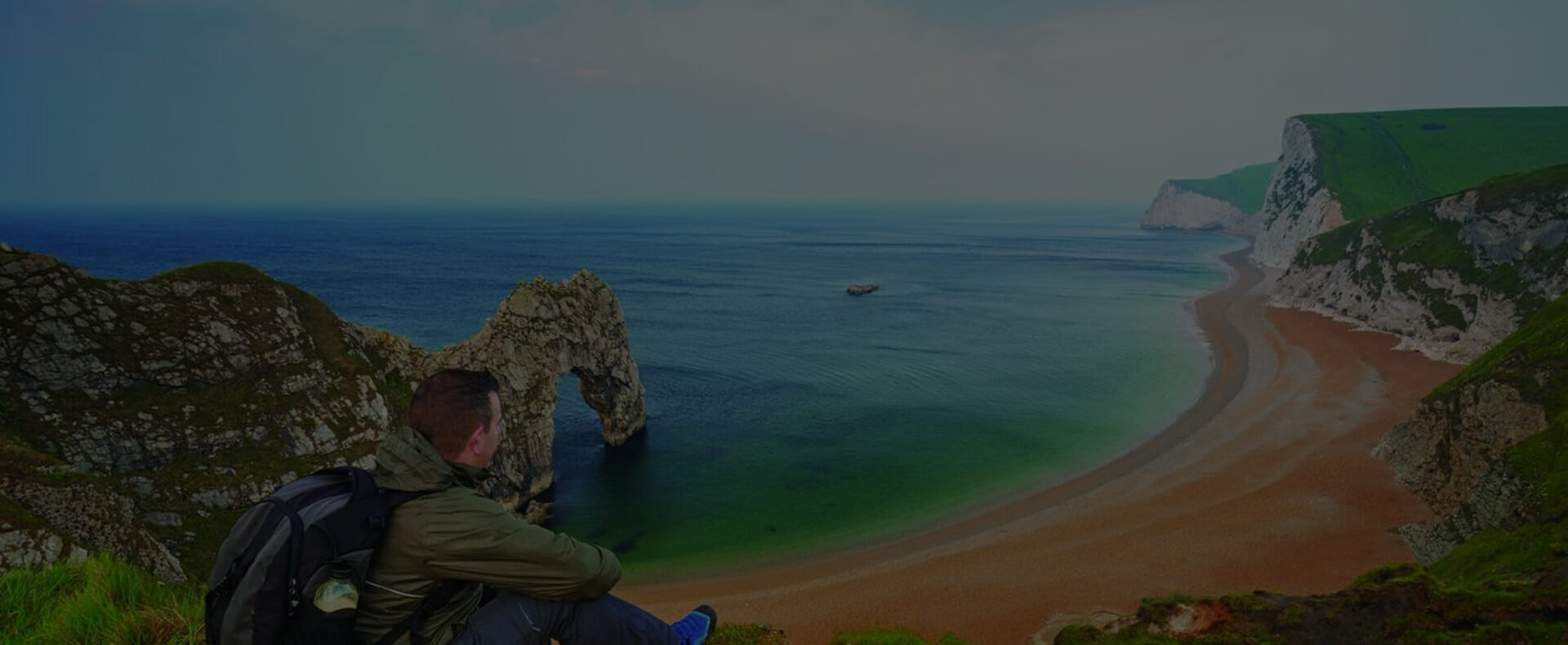 person sitting beach dorset