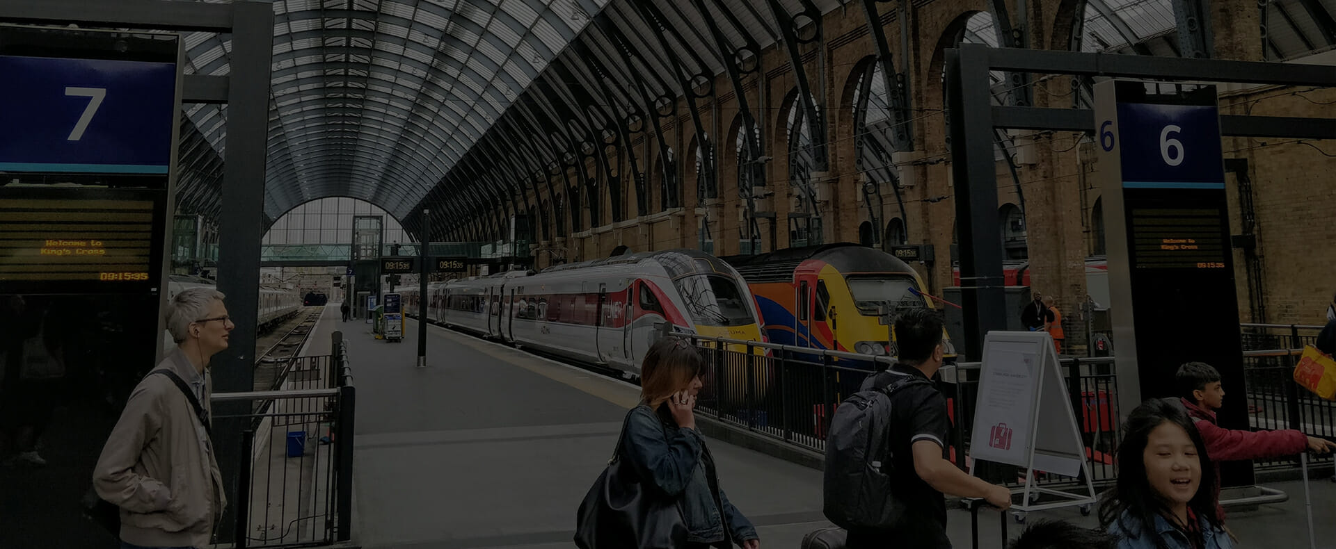 london kings cross station platform 6 and 7 lner train passengers walking