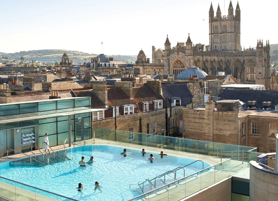 Bath Holiday Inn Express rooftop hotel swimming pool with people swimming and beside by the pool