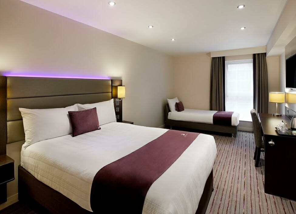 Premier Inn Taunton East Hotel room with a double bed and twin bed during the day