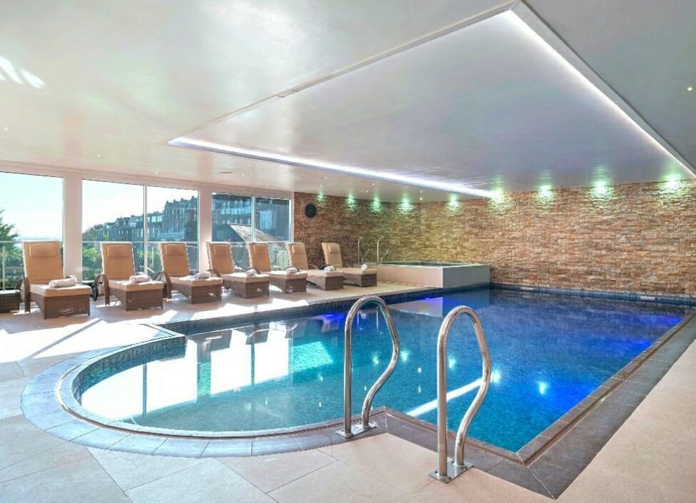 St Ives Harbour Hotel and Spa swimming pool with loungers to the side