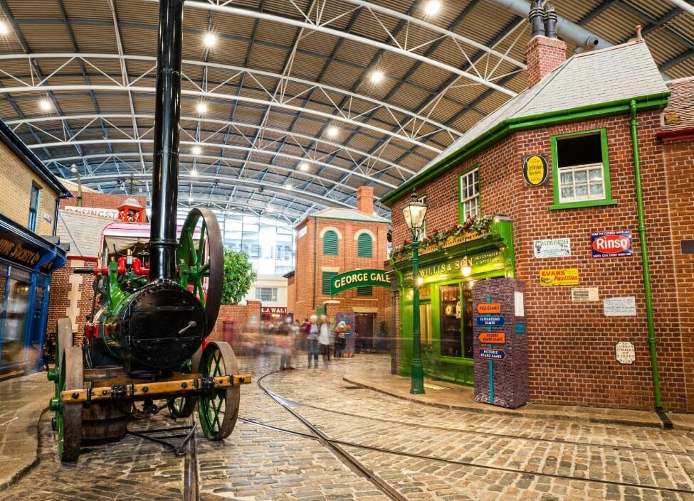 basingstoke milestones museum with tram lines shops and locomotive in warehouse
