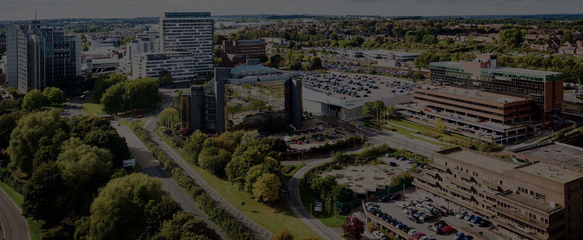 basingstoke town centre with tall buildings cars and trees