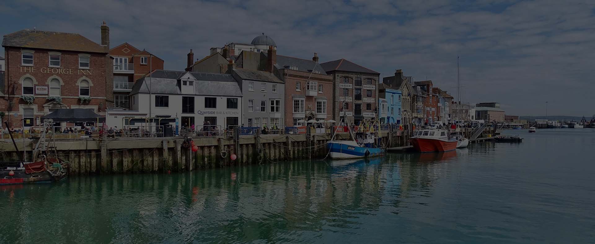 weymouth habroub with buildings on the harbour by the sea with boats