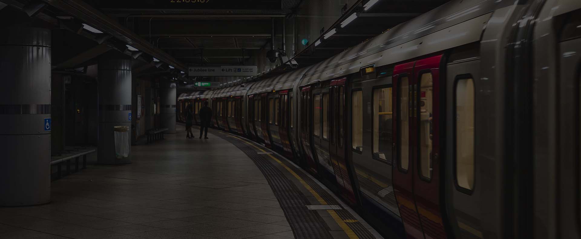 tfl train london red and white at platform on wimbledon district line