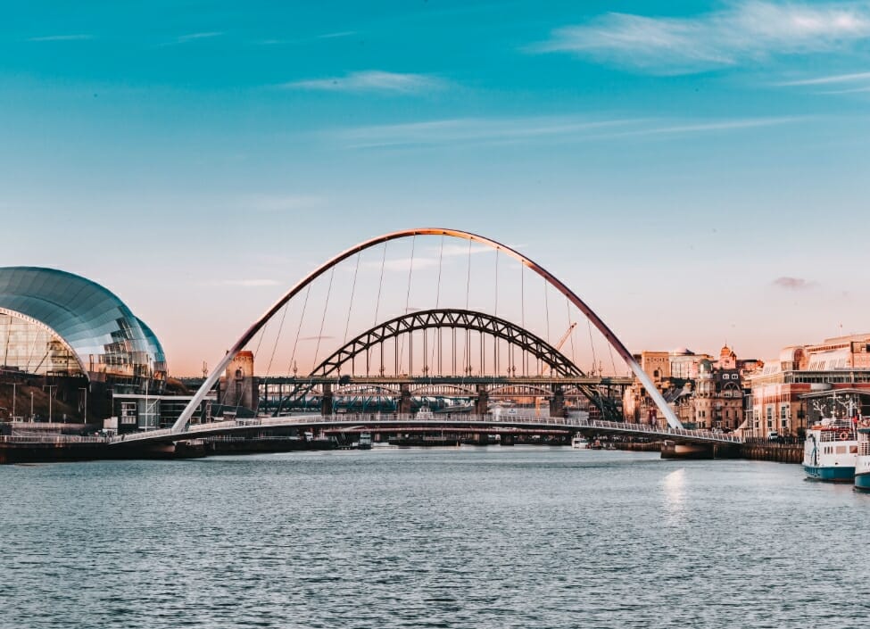 The Millennium Bridge, Tyne Bridge, and The Sage on the River Tyne with the Newcastle Quayside to the side.