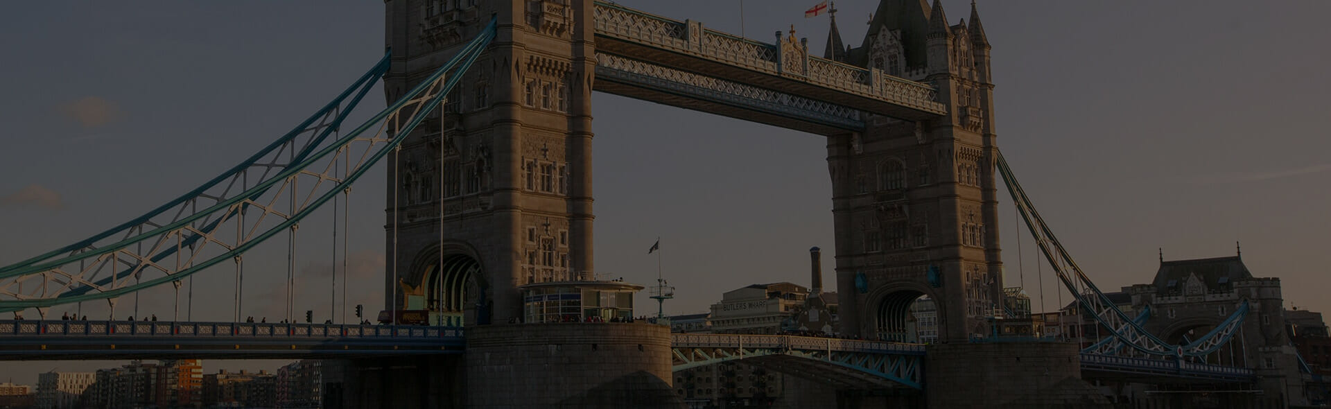 London bridge in city of London with dark sky in background