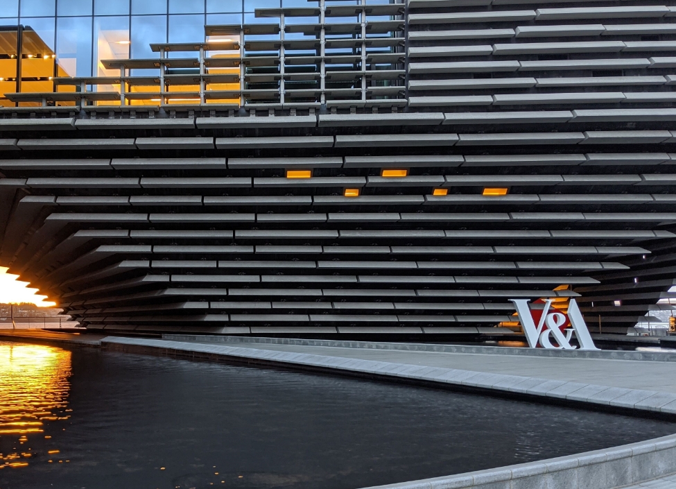 V and A Museum Dundee, a grey building with a futuristic design with water in front