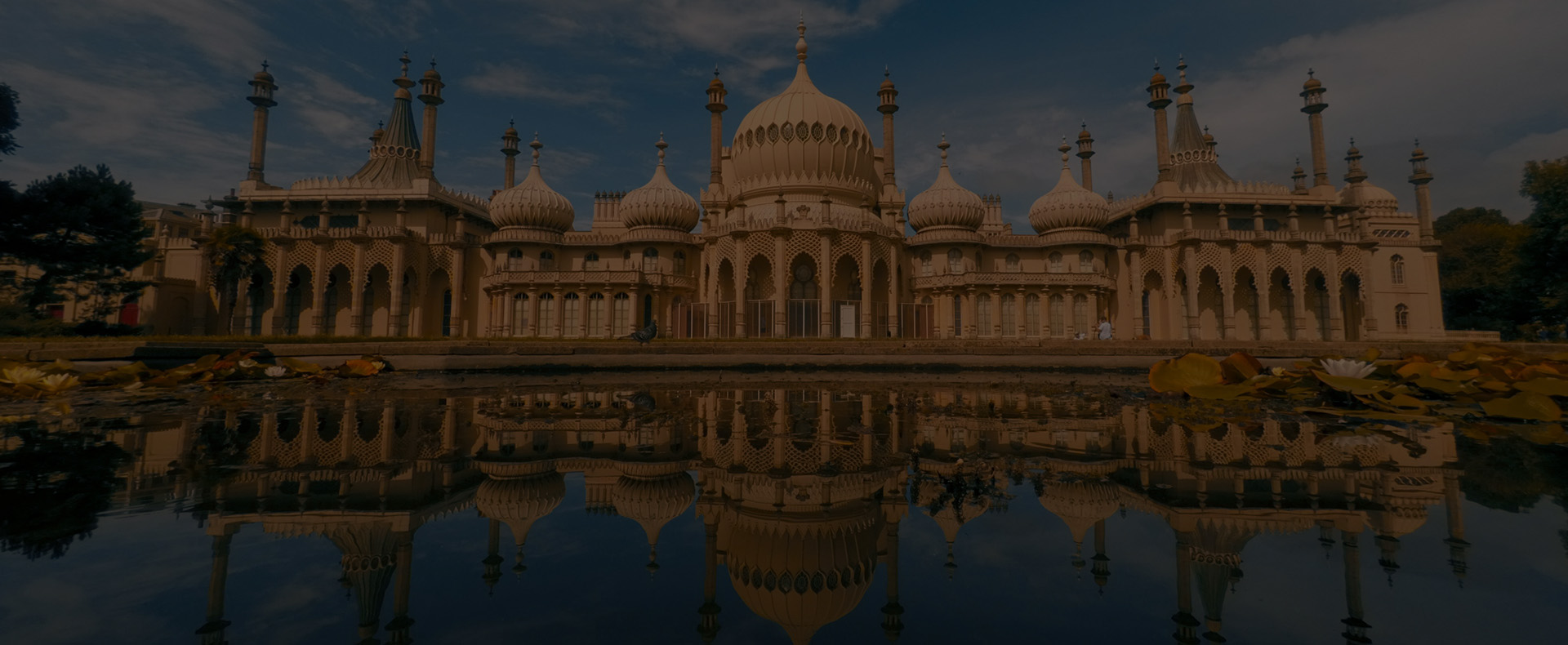 The Royal Pavilion in Brighton, a large former royal residence building with a lake in front
